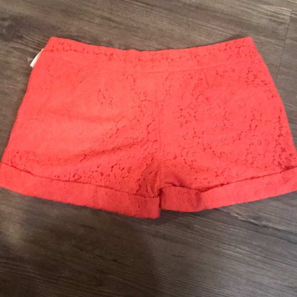 Chino style shorts with lace overlay. - Picture 2 of 4
